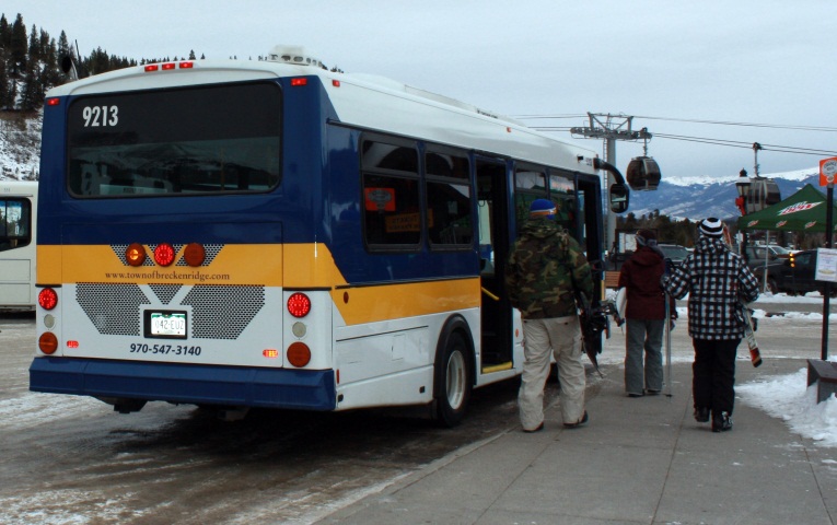 Passengers loading the Free Ride bus with the Gondola in the background