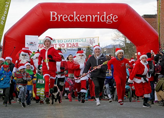 Race of the Santas under Breckenridge sign