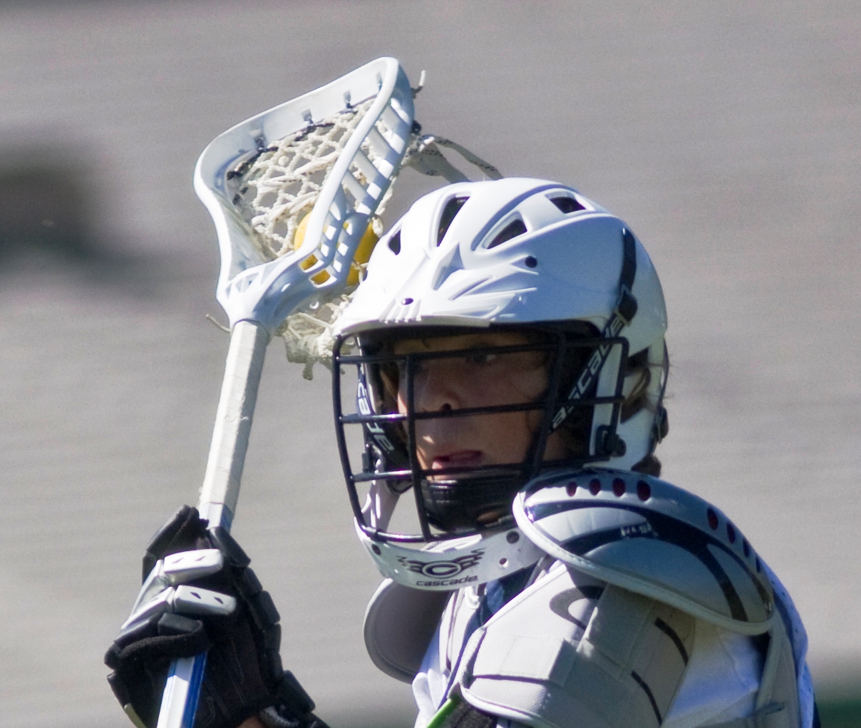 Male lacrosse player with stick