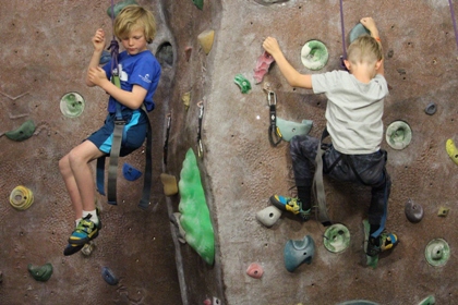 Two young boys on climbing wall