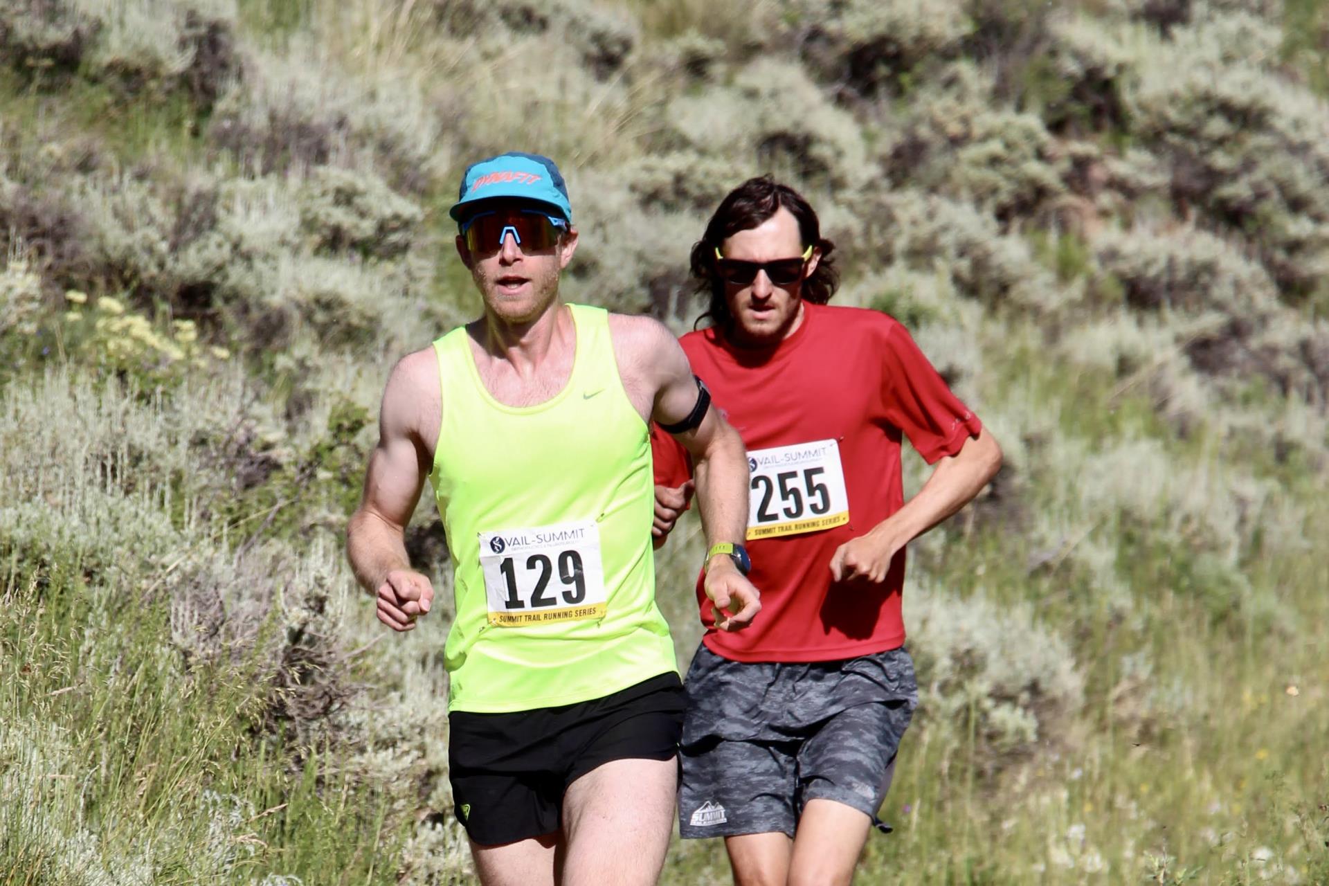 two men running in a trail running race