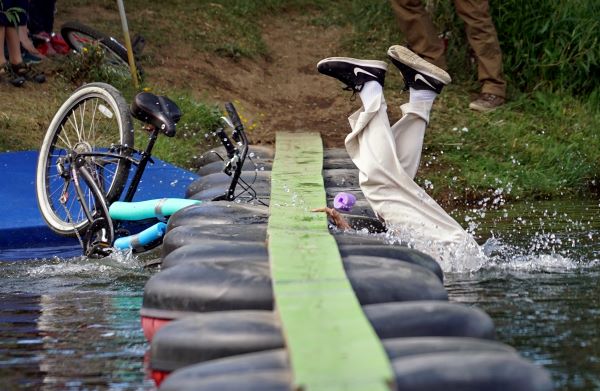 Biker falling off water crossing