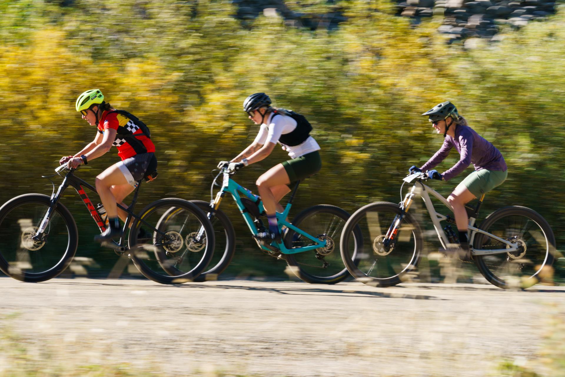 Three mountain bikers in Fall Classic race